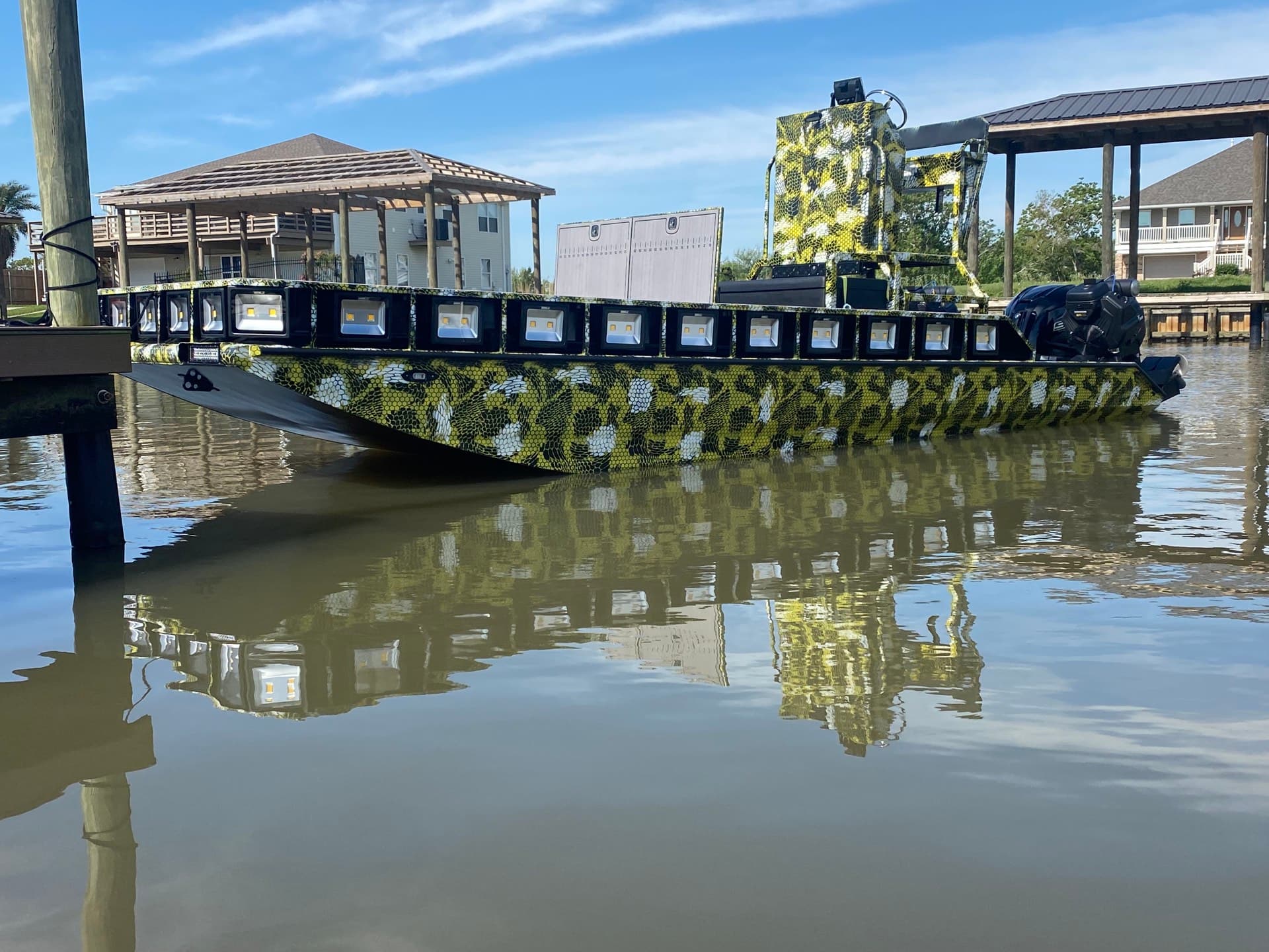 Hooked on Tails bowfishing boat with lights for nighttime Louisiana charters