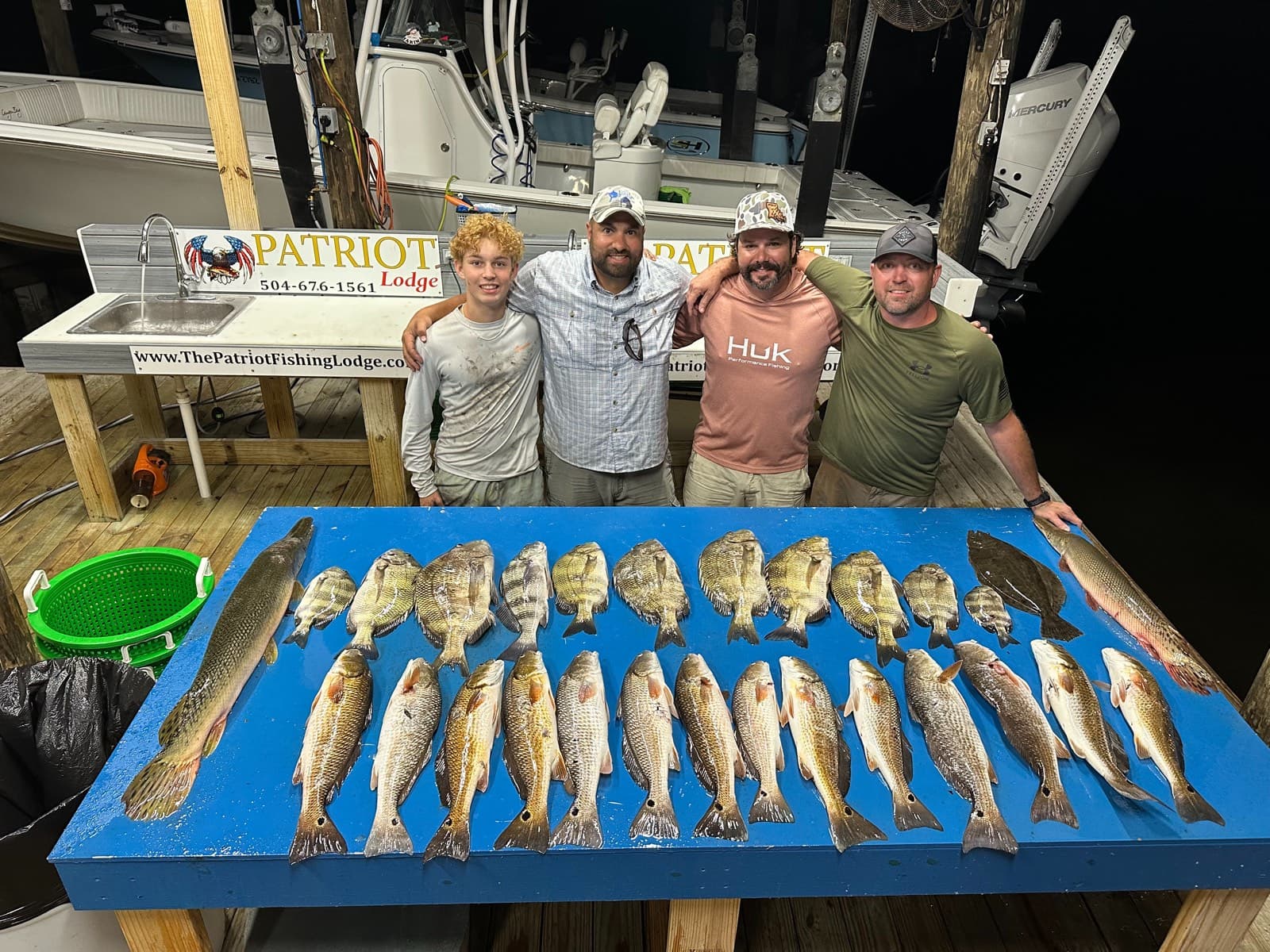 Night bowfishing charter action in the Louisiana marsh near New Orleans
